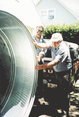 Keith & Eric roll the tank off the back of truck