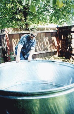 Keith pulls stock tank into place